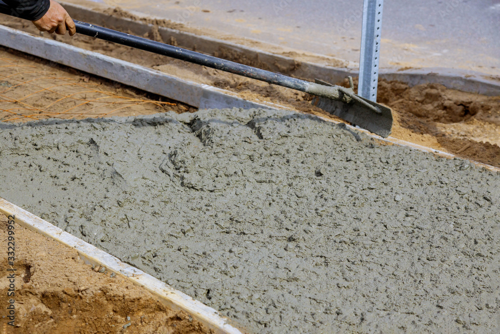Making of a freshly poured cement sidewalk Making of a freshly poured cement sidewalk