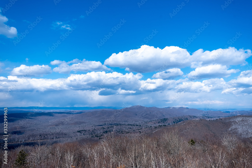 Beautiful blue sky, white clouds in the mountains