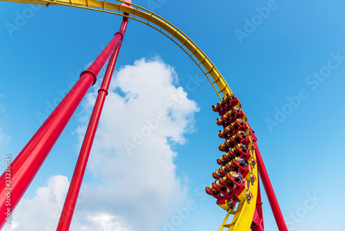 Rollercoaster Ride in theme park with blue sky © leeyiutung