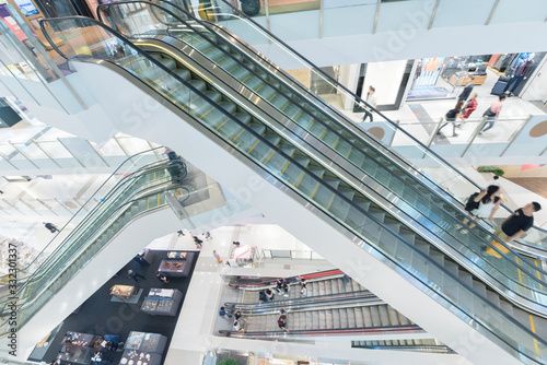 Interior view of escalator in shopping mall photo