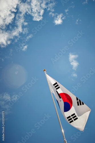 South Korean flag on sky background 