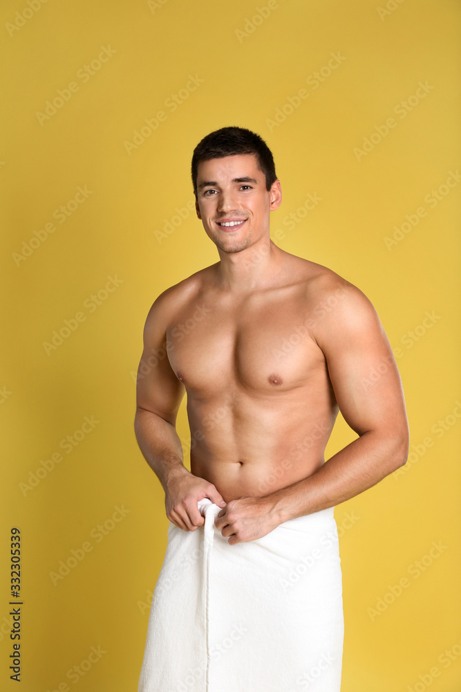 Man with sexy body on yellow background
