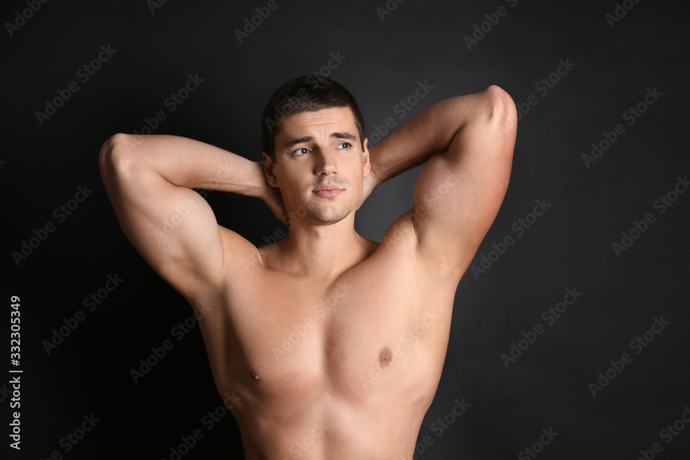 © New Africa - Man with sexy body on black background