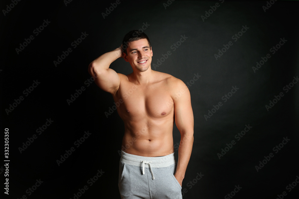 Man with sexy body on black background