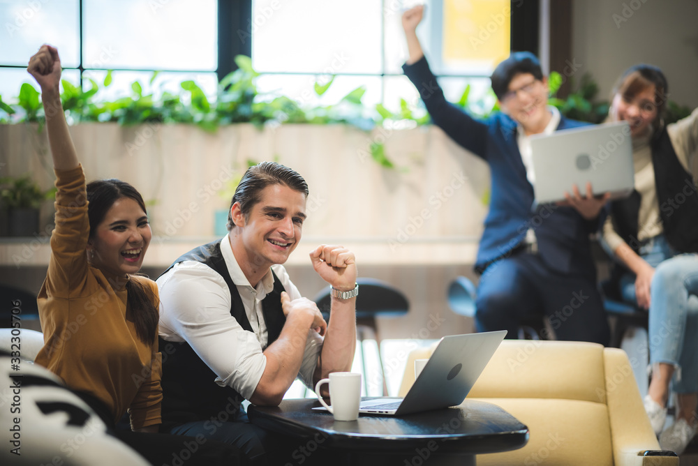 success and winning concept - happy business team celebrating victory in coworking space success and winning concept - happy business team celebrating victory in coworking space