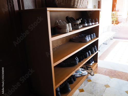 Wooden shoe cabinet with shoes