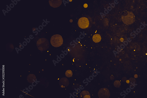 Dark Abstract Gold bokeh sparkle on black