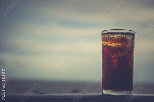 Cola with ice in the glass ready to drink for refresh