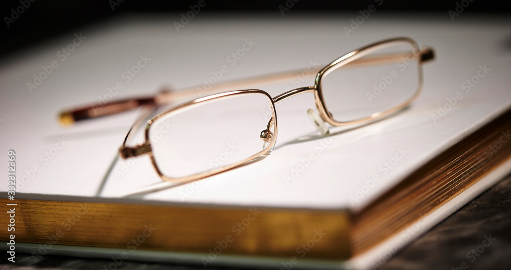 Reading glass on a book