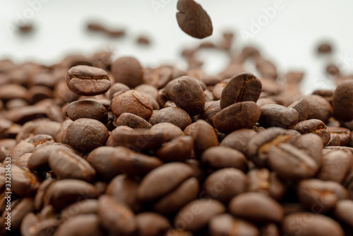 coffee beans close up on a white isolated background copy space.