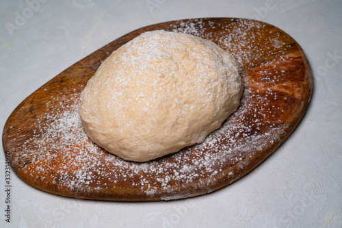 top view dough for pizza on white table on Board 