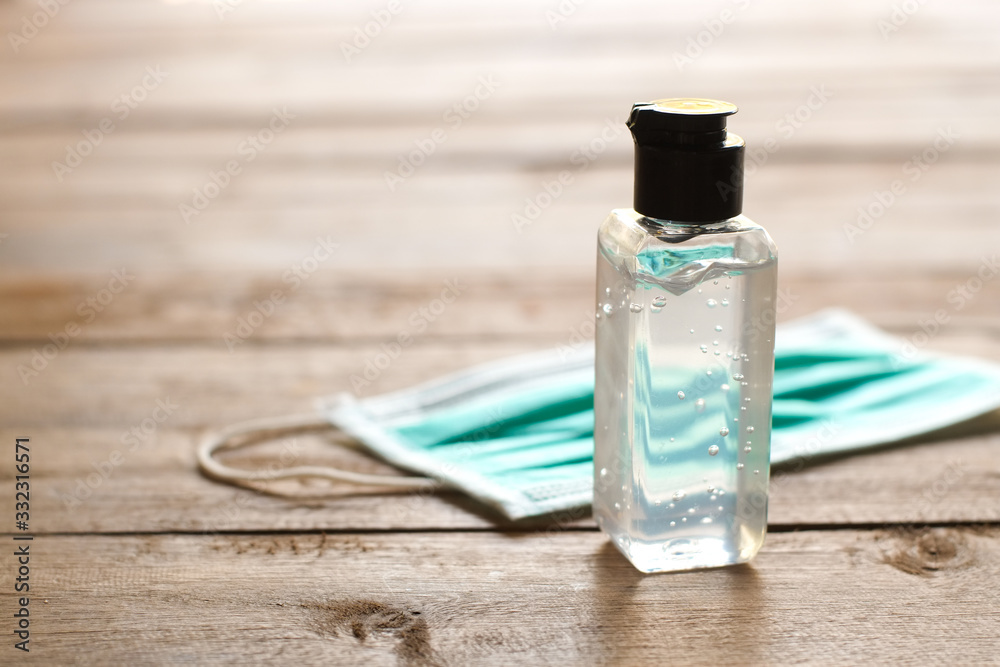 Alcohol gel and masks are used for preventing epidemics from virus covid-19 and germs close-up. Alcohol gel and masks are used for preventing epidemics from virus covid-19 and germs close-up.