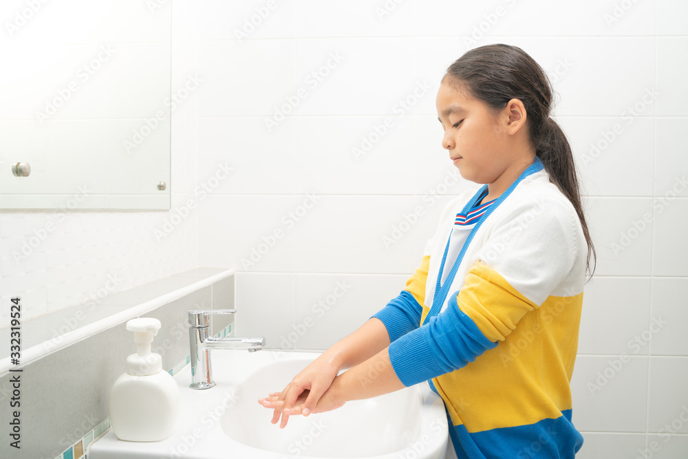 Asian girl Washing hands rubbing with soap for corona virus prevention, hygiene to stop spreading coronavirus or covid-19 Asian girl Washing hands rubbing with soap for corona virus prevention, hygiene to stop spreading coronavirus or covid-19