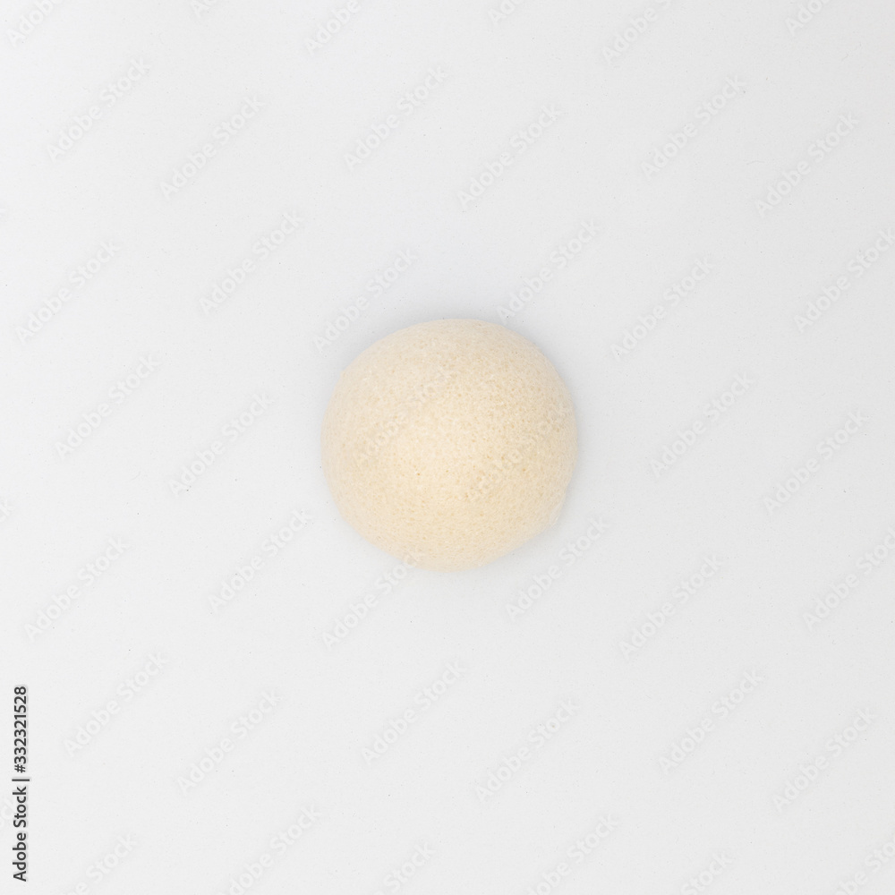 top view of cleaning pores and removes old skin smoothly natural konjac puff sponge for sensitive body skincare shower scrubbing on white background top view of cleaning pores and removes old skin smoothly natural konjac puff sponge for sensitive body skincare shower scrubbing on white background