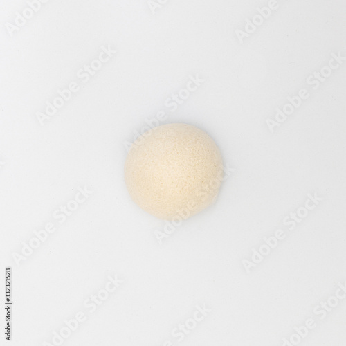 top view of cleaning pores and removes old skin smoothly natural konjac puff sponge for sensitive body skincare shower scrubbing on white background