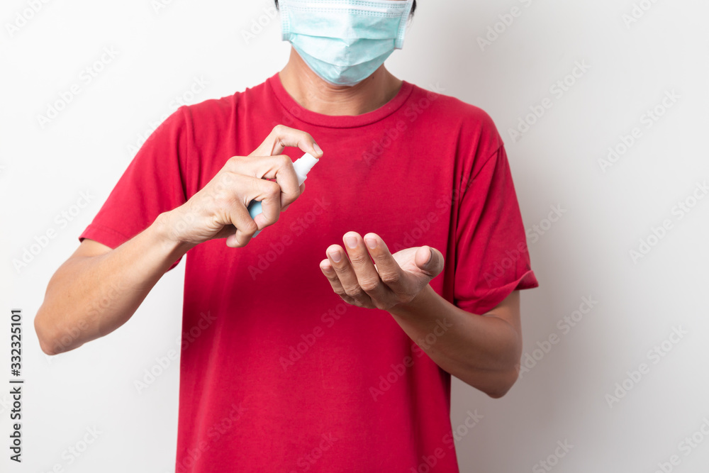 closeup of Man hold Antiseptic spray on white background