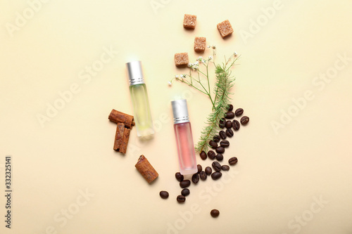 Beautiful composition with perfume bottles on color background