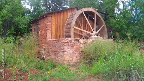 Old Fashioned Water Wheel And Wooden Shed