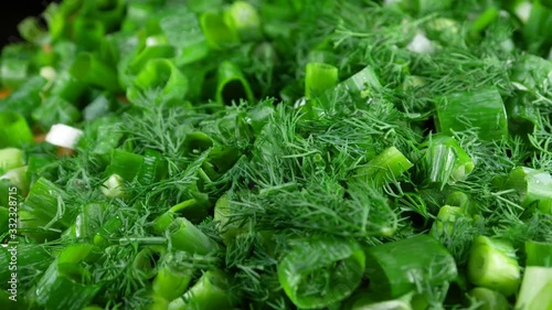 Chopped dill and onion greens as background photo