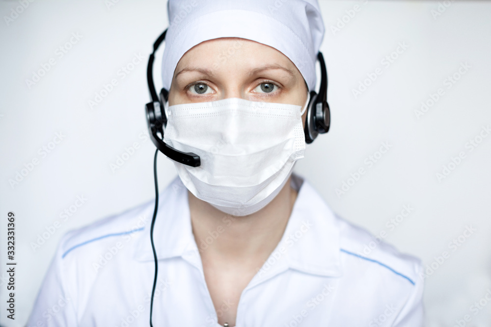 Portrait of a beautiful medical woman wearing protective mask with handset. Portrait of a beautiful medical woman wearing protective mask with handset.