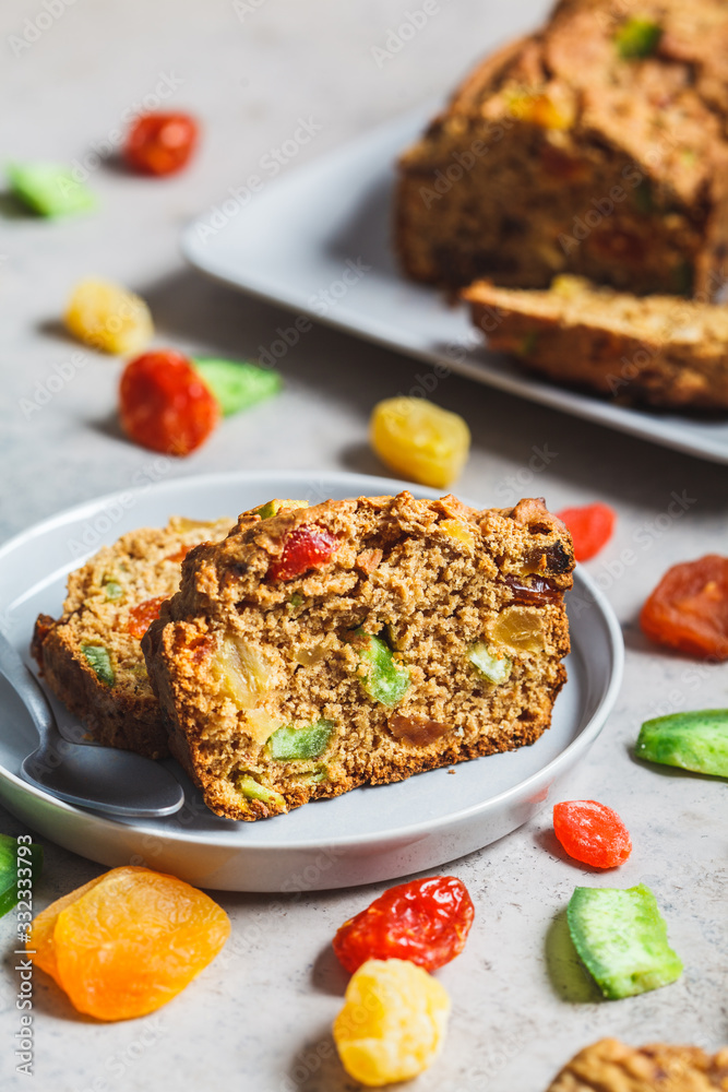 Pieces of dried fruit bread on a gray plate.