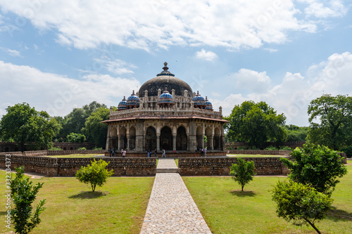 beautiful isa khan's tomb surrounded by its lush garden in delhi, india