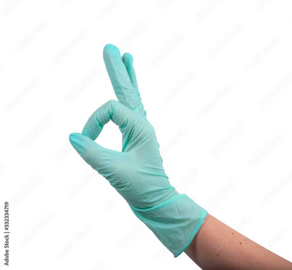 Green rubber glove on hand isolated on the white Green rubber glove on hand isolated on the white