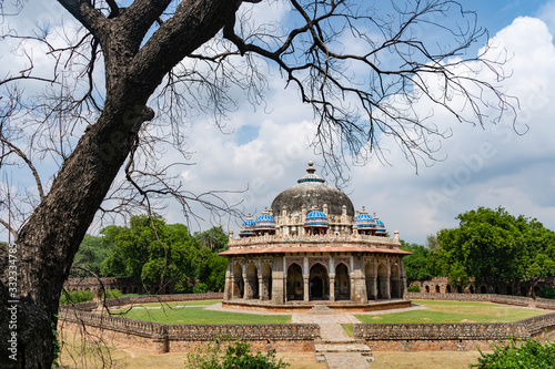 beautiful isa khan's tomb surrounded by its lush garden in delhi, india photo