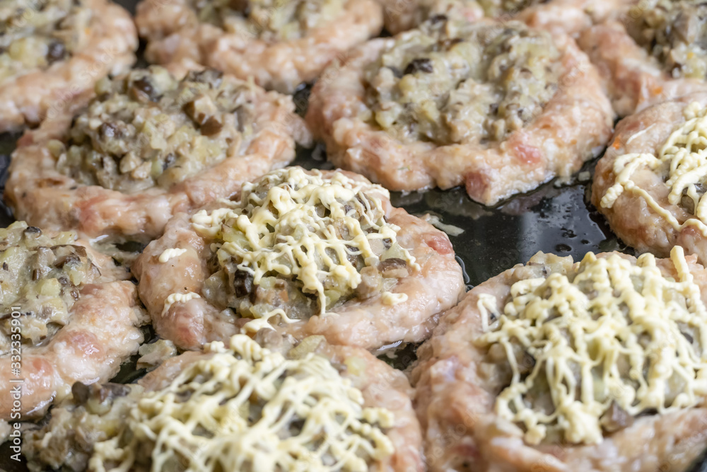 Minced meat balls stuffed with mushrooms close-up. Before baking Minced meat balls stuffed with mushrooms close-up. Before baking