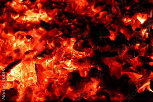 Very hot smouldering embers in the grill. Fire background for barbecue.