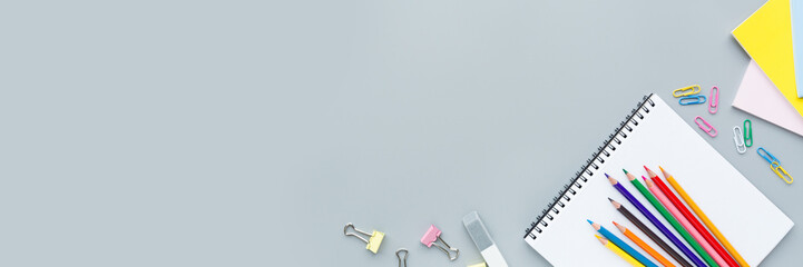 Back to School background with place for text. Horizontal banner for web design. Collection of school supplies in a bright flat style. Educational concept. Copy space, mockup, overhead, template.