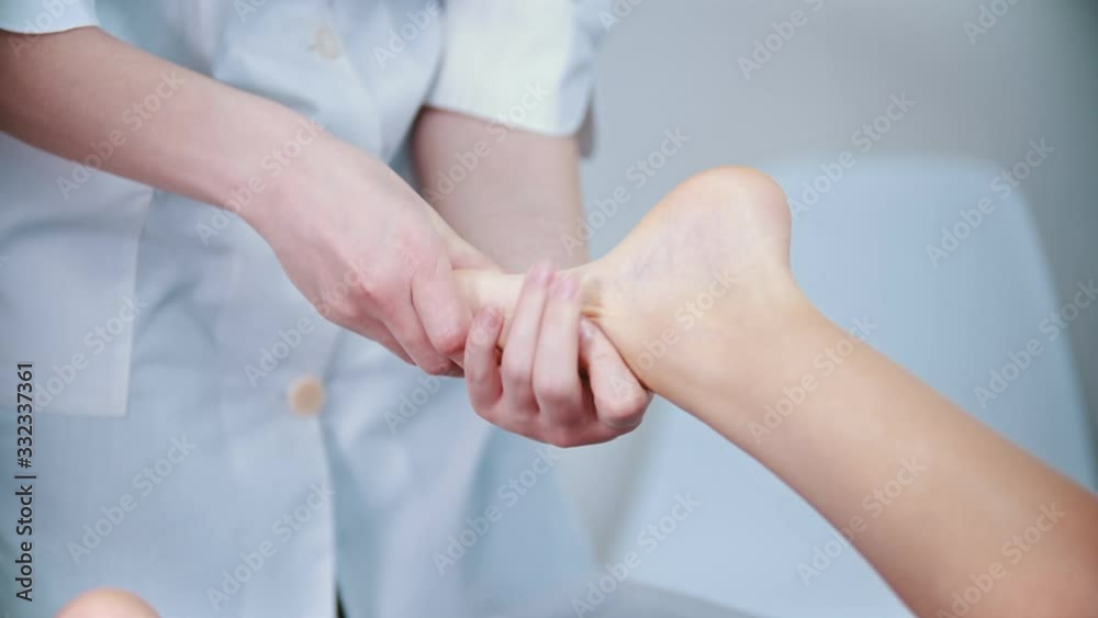Massage - massage master is kneading womans feet with her fingers Massage - massage master is kneading womans feet with her fingers
