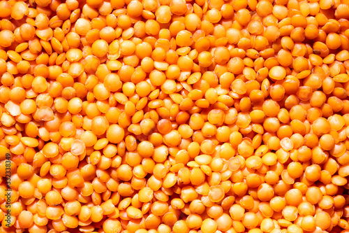 Close up red lentil seeds background. Healthy vegeterian food. Texture. photo