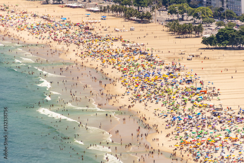 Copacabana beach full on a typical sunny Sunday in Rio de Janeiro. © BrunoMartinsImagens