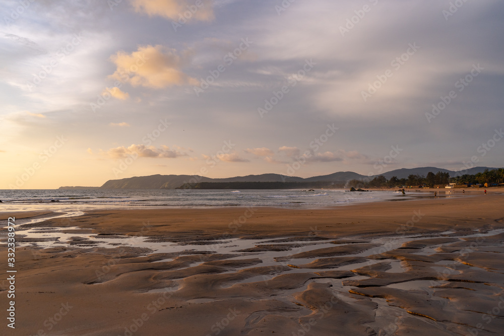 beautiful reflexions in the water at the beach in goa, india