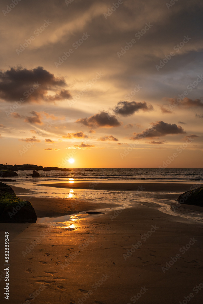 beautiful colorful sunset on agonda beach in goa, india beautiful colorful sunset on agonda beach in goa, india