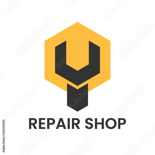 Repair shop logo. Wrench, spanner inside hexagon.