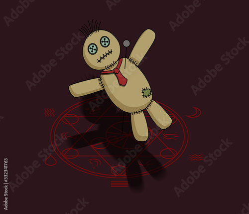 Voodoo doll pierced with pin lying on magic circle
