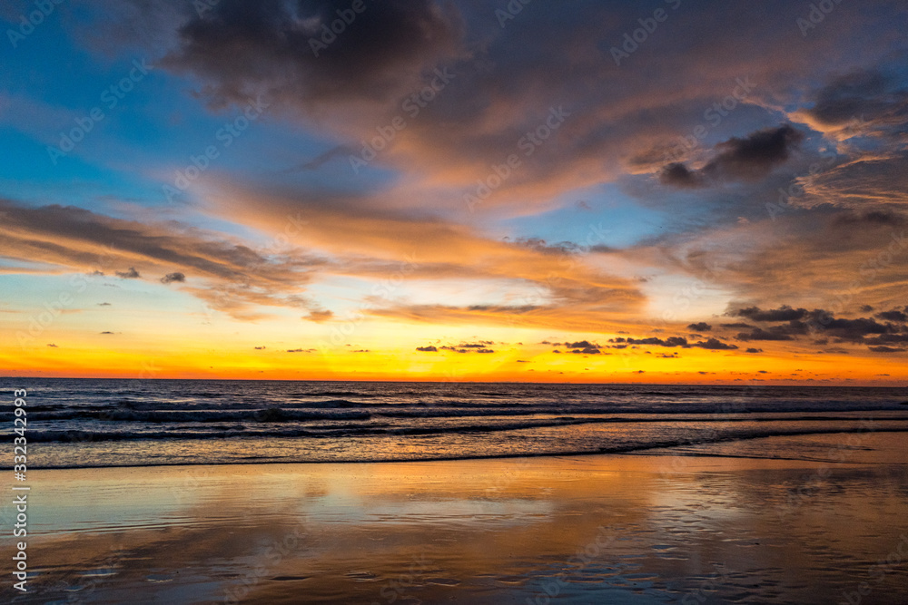 beautiful colorful sunset on agonda beach in goa, india beautiful colorful sunset on agonda beach in goa, india