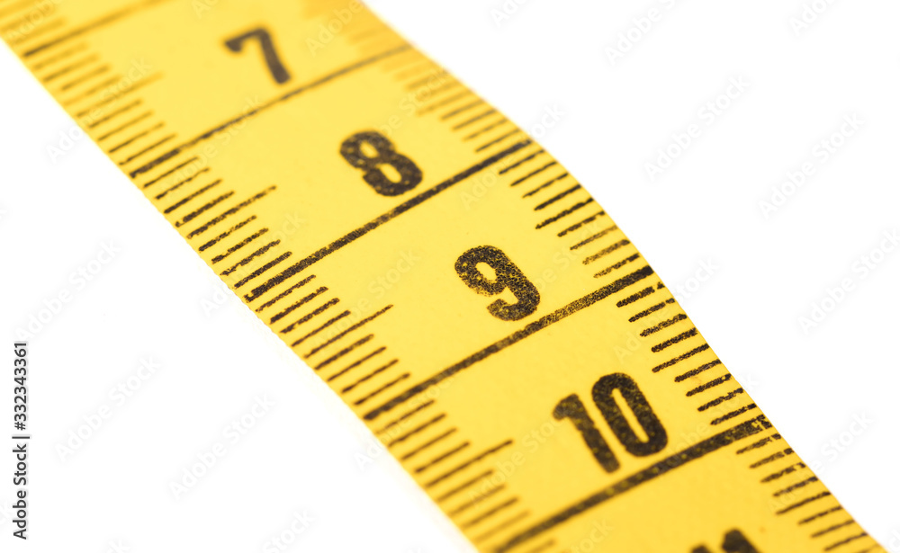 Close-up of a yellow measuring tape isolated on white - 9 Close-up of a yellow measuring tape isolated on white - 9