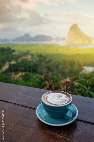Coffee cup on wooden table in the morning, Coffee in the nature view.