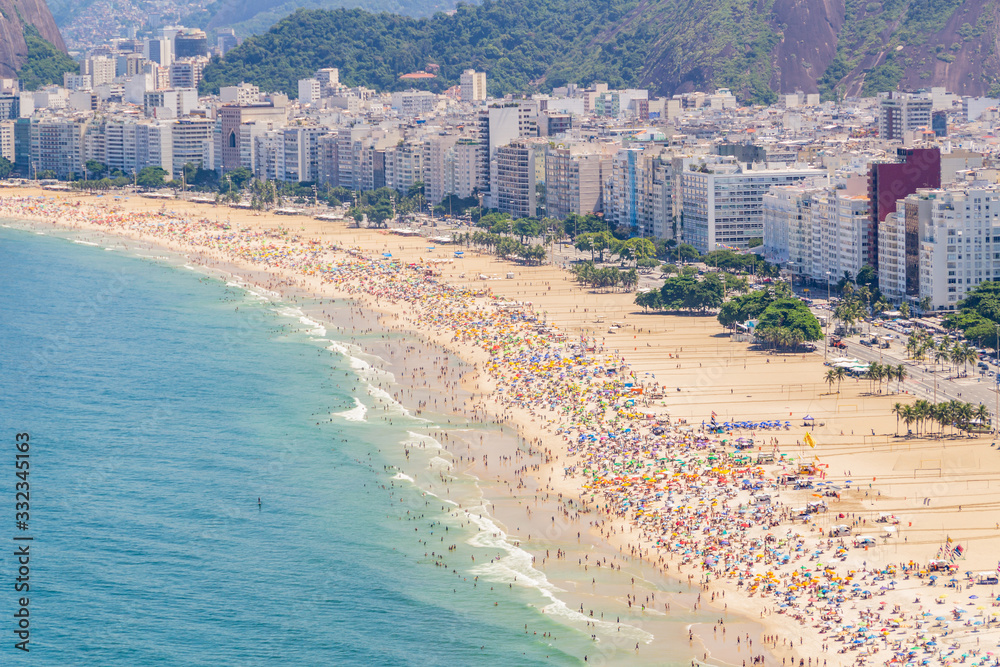 Copacabana beach full on a typical sunny Sunday in Rio de Janeiro.