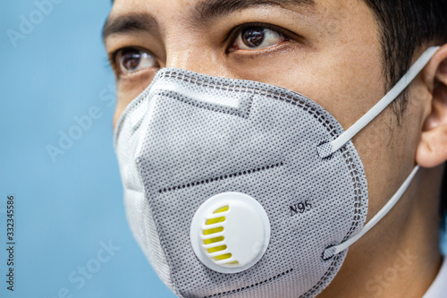 A man is wearing n95 mask for protect covid 19 and air pollution pm2.5 photo