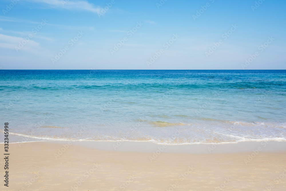 Gentle aqua blue sea waves on a sunny day with copy space. Phuket, Thailand