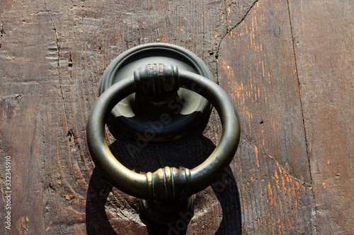 Firenze, Italy - April 21, 2017: An old knocker on a door in Florence, Firenze, Tuscany, Italy