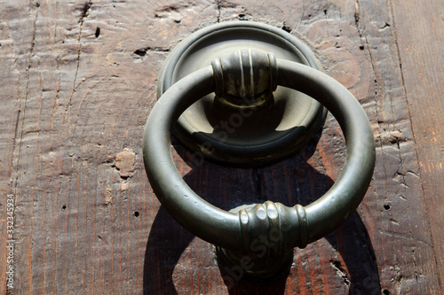 Firenze, Italy - April 21, 2017: An old knocker on a door in Florence, Firenze, Tuscany, Italy