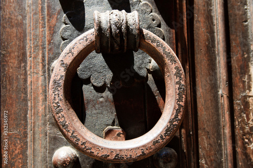 Firenze, Italy - April 21, 2017: An old knocker on a door in Florence, Firenze, Tuscany, Italy