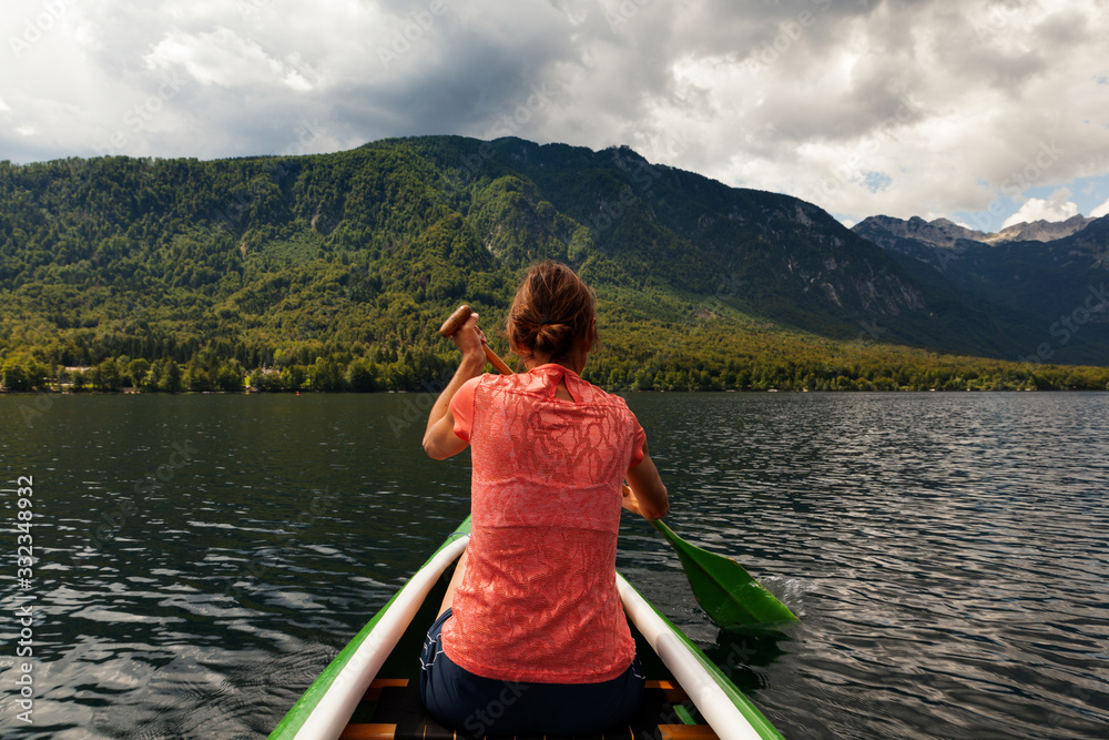 Girl kayaking in the Bohinj lake