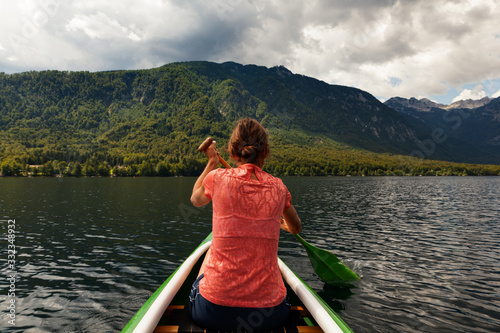 Girl kayaking in the Bohinj lake