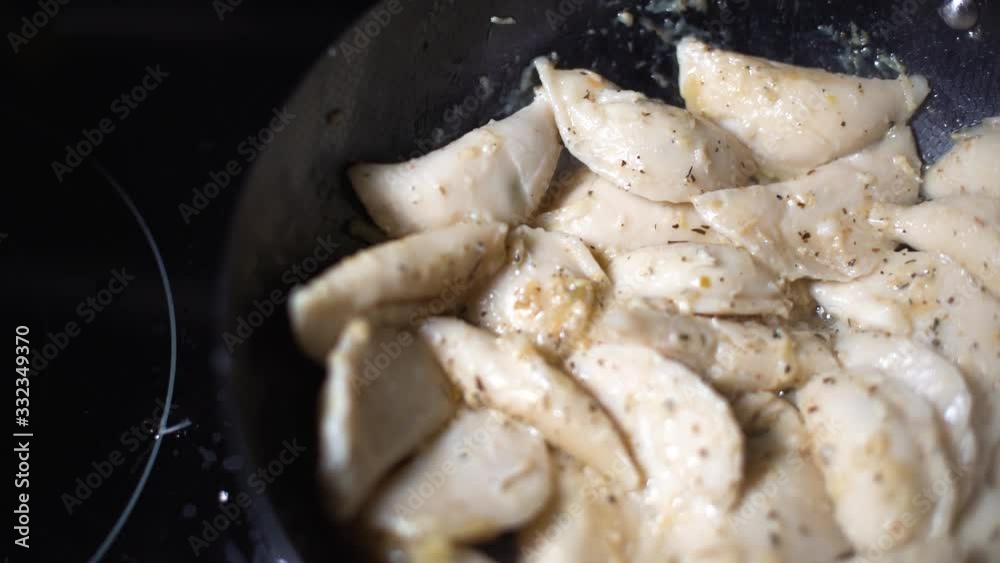 dolly slide right. Frying pelmeni pierogis in hot black frying pan. Appetizing looking food. dolly slide right. Frying pelmeni pierogis in hot black frying pan. Appetizing looking food.